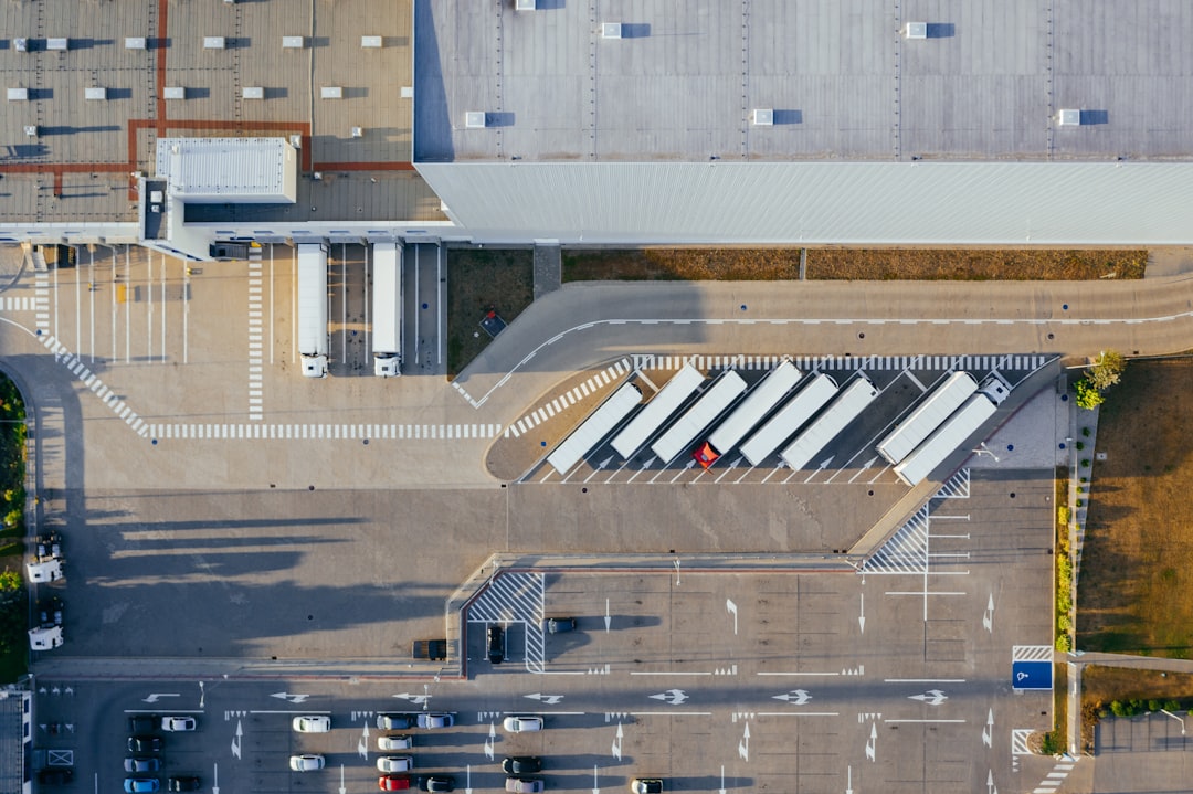 California logistics warehouse with loading docks and trucks